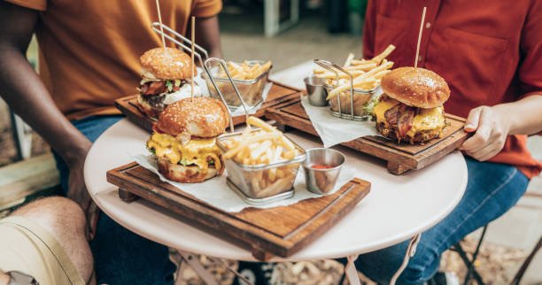 How do fast food portions compare to recommended servings?